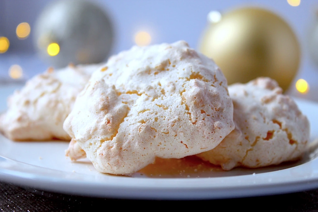 Light, crisp, airy meringue cookies with a coconut filled marshmallowy center.